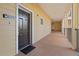 Building hallway with dark brown doors and light beige walls at 3050 Pirates Retreat Ct # 303, Kissimmee, FL 34747