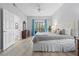 Spacious main bedroom with plush bed, large windows, and ample natural light at 3050 Pirates Retreat Ct # 303, Kissimmee, FL 34747