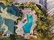 Resort-style pool with surrounding lounge chairs and landscaping at 3050 Pirates Retreat Ct # 303, Kissimmee, FL 34747