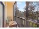 Relaxing screened balcony with seating and wooded views at 3050 Pirates Retreat Ct # 303, Kissimmee, FL 34747