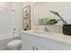 Clean bathroom with white vanity, a large mirror, and tasteful decor at 3231 Arch Ave, Ormond Beach, FL 32174