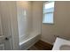 Bathroom with shower/tub combo and tile surround at 3238 Arch Ave, Ormond Beach, FL 32174
