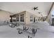 A covered community space featuring picnic tables and ceiling fans, providing a comfortable outdoor gathering area at 3238 Arch Ave, Ormond Beach, FL 32174