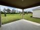 Spacious covered patio overlooking a large backyard at 3238 Arch Ave, Ormond Beach, FL 32174