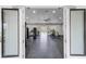 Well-equipped gym overlooking an outdoor pool area at 3238 Arch Ave, Ormond Beach, FL 32174
