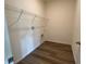 Bright laundry room with ample shelving and vinyl flooring at 3238 Arch Ave, Ormond Beach, FL 32174