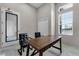 Bright office space with a desk, chairs, and ample storage at 3238 Arch Ave, Ormond Beach, FL 32174