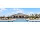 Beautiful pool with lounge chairs and umbrellas offers resort-style living for the whole Gathering at 3238 Arch Ave, Ormond Beach, FL 32174