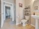 Clean bathroom with a toilet, shower, and a small vanity at 351 Michigan Estates Cir, St Cloud, FL 34769