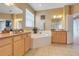 Spacious bathroom with double sinks, soaking tub, and separate shower at 351 Michigan Estates Cir, St Cloud, FL 34769