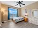 Serene bedroom with a double bed, large window, and dresser at 351 Michigan Estates Cir, St Cloud, FL 34769