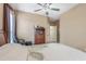 Spacious bedroom with ceiling fan, built-in shelving, and private access at 351 Michigan Estates Cir, St Cloud, FL 34769
