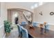 Elegant dining room with a view into the kitchen at 351 Michigan Estates Cir, St Cloud, FL 34769