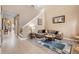 Spacious living room with a sectional sofa and high ceilings at 351 Michigan Estates Cir, St Cloud, FL 34769