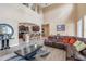 Bright living room with hardwood floors and a comfortable sectional sofa at 351 Michigan Estates Cir, St Cloud, FL 34769