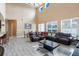 Open living area with a large sectional sofa and high ceilings at 351 Michigan Estates Cir, St Cloud, FL 34769