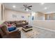 Spacious living room with sectional sofa and high ceilings at 351 Michigan Estates Cir, St Cloud, FL 34769
