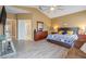 Main bedroom with king-size bed, ensuite bathroom, and sitting area at 351 Michigan Estates Cir, St Cloud, FL 34769