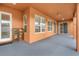 Covered patio with multiple windows and ceiling fan at 351 Michigan Estates Cir, St Cloud, FL 34769