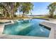 Large pool with lake view and brick deck at 401 N 1St St, Lake Mary, FL 32746