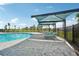 Inviting community pool with shaded seating for residents to lounge at 4152 Lavender Ct, Haines City, FL 33844