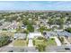 Aerial view of a single-Gathering home with a large backyard and surrounding neighborhood at 4437 Elaine Pl, Orlando, FL 32812