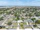 Aerial view showcases a residential neighborhood featuring cozy homes with manicured lawns and tree-lined streets at 4437 Elaine Pl, Orlando, FL 32812