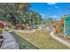Landscaped backyard with brick walkways and lush greenery at 4437 Elaine Pl, Orlando, FL 32812
