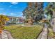 Mature tree and manicured lawn enhance this backyard at 4437 Elaine Pl, Orlando, FL 32812