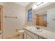 Neutral bathroom featuring a shower with sliding glass doors and single sink vanity at 4437 Elaine Pl, Orlando, FL 32812