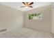 Cozy bedroom featuring tile flooring and bright natural light at 4437 Elaine Pl, Orlando, FL 32812