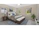 Cozy bedroom with bright windows, neutral tones, and patterned accent rug at 4437 Elaine Pl, Orlando, FL 32812