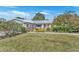 Ranch-style home with mature landscaping and a spacious yard at 4437 Elaine Pl, Orlando, FL 32812