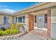 Home's front entrance featuring brick accents and landscaping at 4437 Elaine Pl, Orlando, FL 32812