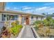 Brick entryway with a walkway and mature landscaping at 4437 Elaine Pl, Orlando, FL 32812