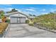 Two-car garage with a large concrete driveway at 4437 Elaine Pl, Orlando, FL 32812