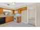 Cozy kitchen with wooden cabinets, white countertops, and tile flooring at 4437 Elaine Pl, Orlando, FL 32812