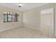 Neutral living room featuring tile flooring, natural light and view to outdoors at 4437 Elaine Pl, Orlando, FL 32812