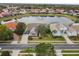 Luxury home with stone exterior, landscaping, and large driveway at 4922 Kensington Park Blvd, Orlando, FL 32819