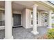 Elegant front entrance with black double doors and columns at 4922 Kensington Park Blvd, Orlando, FL 32819