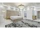 Luxurious main bedroom with large bed and ensuite bath at 4922 Kensington Park Blvd, Orlando, FL 32819