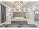 Bright main bedroom with a plush bed and ensuite bathroom at 4922 Kensington Park Blvd, Orlando, FL 32819