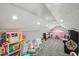 Fun playroom with toys, a play tent, and an arcade game at 4922 Kensington Park Blvd, Orlando, FL 32819