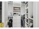 Spacious walk-in closet with ample shelving and hanging space at 4922 Kensington Park Blvd, Orlando, FL 32819