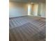 Spacious bonus room with grey carpet and neutral walls at 5425 Log Grove Ln, Orlando, FL 32829