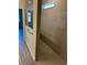 Walk-in shower with glass enclosure and neutral-toned tile at 5425 Log Grove Ln, Orlando, FL 32829