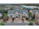 Aerial view of four townhouses with attached garages, located near shopping centers at 558 S Terrace Spring Dr, Orlando, FL 32828