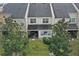 Townhouse backyard with grass and trees at 558 S Terrace Spring Dr, Orlando, FL 32828