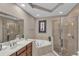 Main bathroom with soaking tub and shower at 558 S Terrace Spring Dr, Orlando, FL 32828