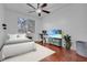 Bedroom with a queen bed and large TV at 558 S Terrace Spring Dr, Orlando, FL 32828